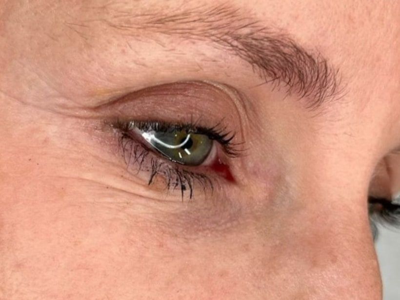 Eyebrow before permanent makeup: fair, sparse hairs with a faint outline.